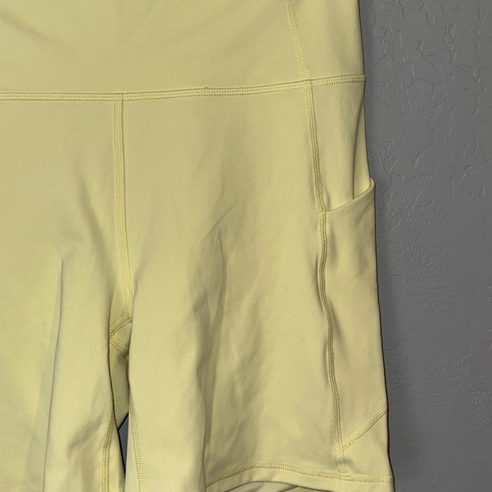 Fabletics Pale Yellow Bike Shorts with Side Pockets - Picture 3 of 6